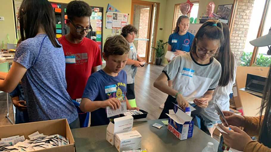 Resident kids in Jamboree’s free onsite summer learning program make first aid kits